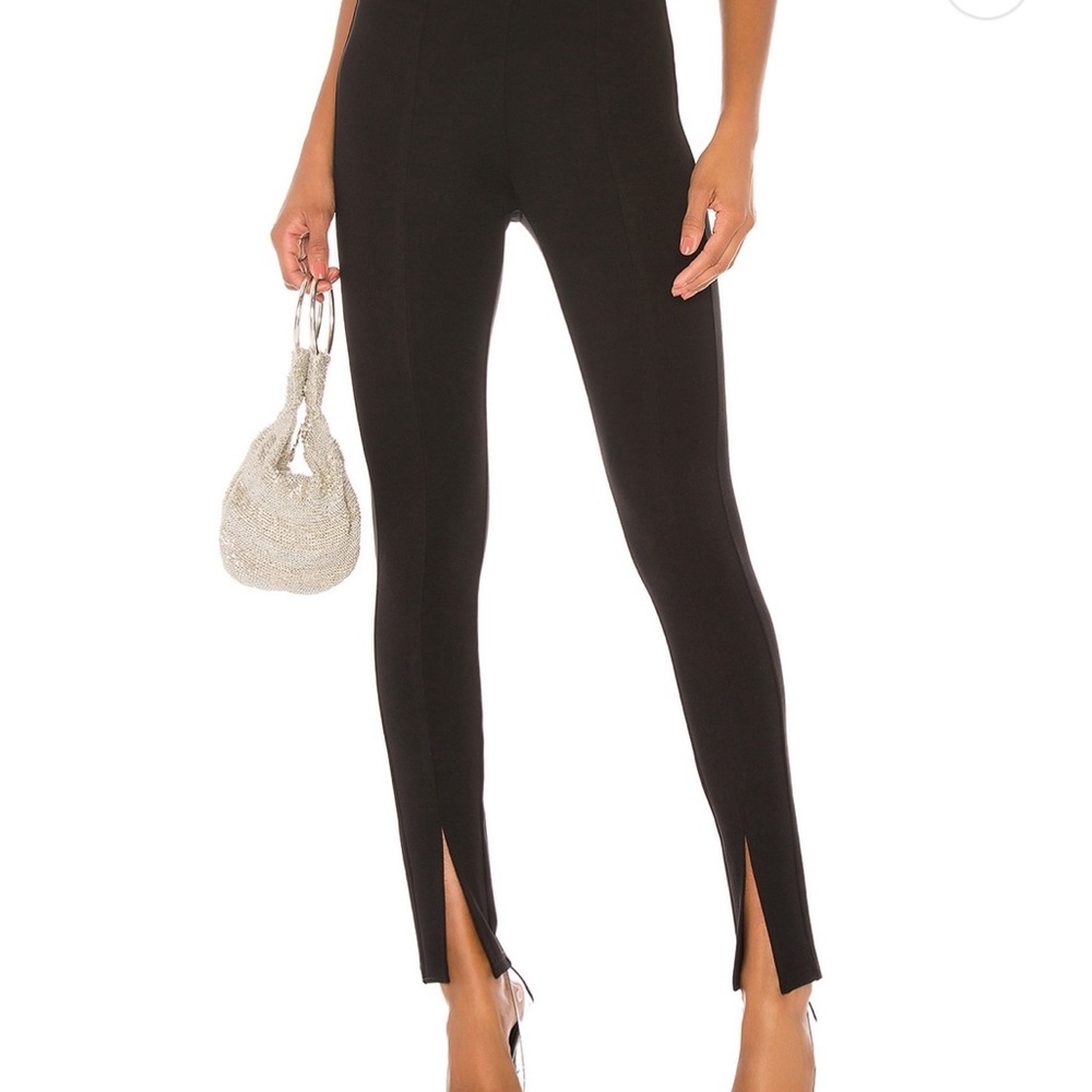 Black Legging with slit hem. Super cute with heels and boots.